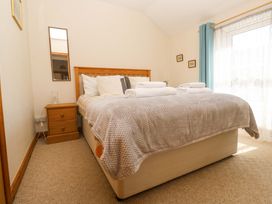 A bedroom with a bed and nightstand at Chyandaunce Gulval