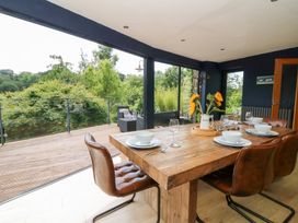A dining room with a table and chairs at The Old Barn in Ciliau Aeron near Aberaeron