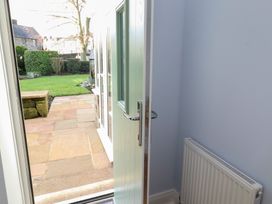 An entrance with a door opening to a garden at Linn Cottage in Hexham