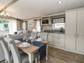 A dining room with a table and chairs at The Beaumont No 34 New Quay