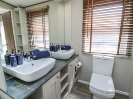 A bathroom with sink and toilet at The Beaumont No 34 New Quay