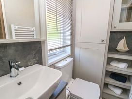 A bathroom with a sink and toilet at The Beaumont No 34 New Quay