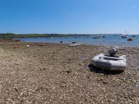 A boat on the shore near water at The Beaumont No 34, New Quay