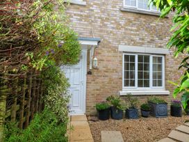 An outdoor area with a door and plants at Fairways House Weymouth