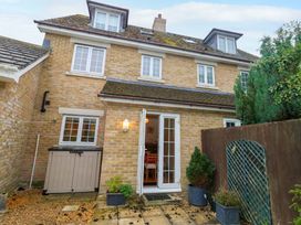 A house with a door and windows at Fairways House in Weymouth