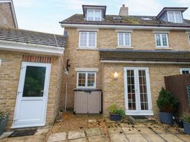 An outdoor area with a door and windows at Fairways House in Weymouth