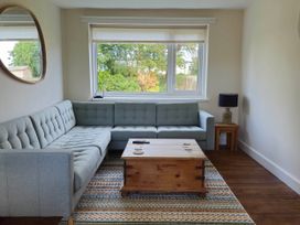 A living room with a sofa and coffee table at 13 Seafield Road