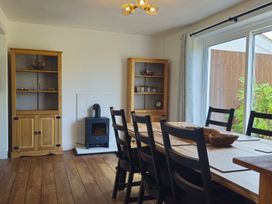 A dining room with a table and chairs at The Warren in Seahouses