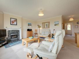 A living room with a sofa and television at The Granary in Alnwick