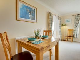 A dining room with a table set for two at The Granary in Alnwick