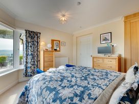 A bedroom with a bed and window at The Granary in Alnwick
