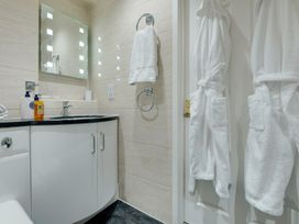 A bathroom with a sink and a mirror at The Granary in Alnwick
