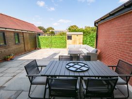 An outdoor area with seating and a table at Sea's The Day in Filey