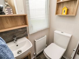 A bathroom with a toilet and sink at Kelly's Retreat in Scarborough