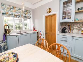 A kitchen with a sink and cabinet at Seacroft in Combe Martin