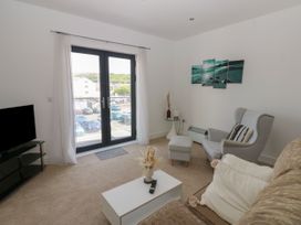 A living room with a sofa and a TV at Seaview in Whitehaven