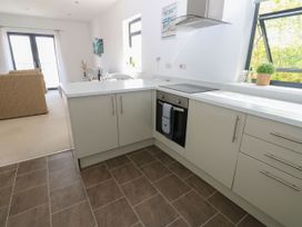 A kitchen with a stove and cabinets at Seaview in Whitehaven
