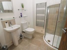 A bathroom with a sink, toilet and shower at Seaview in Whitehaven