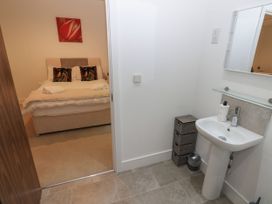 A bathroom with a sink and storage box at Seaview in Whitehaven