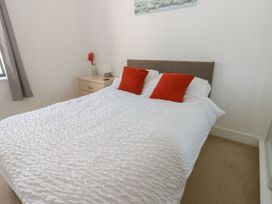 A bedroom with a bed and bedside table at Seaview in Whitehaven