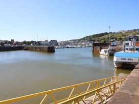 A harbor with boats in the water and buildings in the background at Seaview in Whitehaven