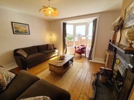 A living room with a coffee table and sofa at Otter Cottage in Weymouth
