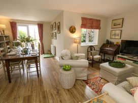 A living room with a dining area and sofa at 31 Bull Lane in Dorchester
