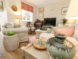 A living room with a television and seating area at 31 Bull Lane in Dorchester
