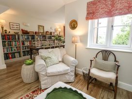 A snug with a sofa and bookshelf at 31 Bull Lane Dorchester