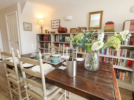 A dining room with a table set for a meal at 31 Bull Lane, Dorchester
