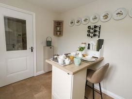 A kitchen with a table set for tea at 31 Bull Lane in Dorchester