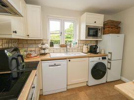 A kitchen with sink and appliances at 31 Bull Lane in Dorchester