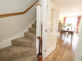 A hallway leading to a dining area with a table and chairs at 31 Bull Lane in Dorchester