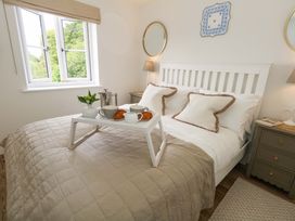 A bedroom with a bed and breakfast tray at 31 Bull Lane in Dorchester
