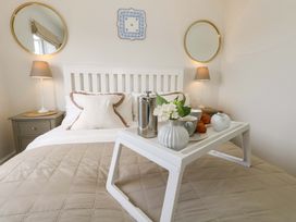 A bedroom with a bed and tray of food at 31 Bull Lane Dorchester