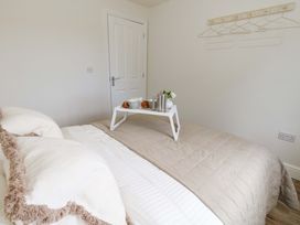A bedroom with a bed and a tray with breakfast at 31 Bull Lane in Dorchester