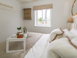 A bedroom with a bed and a tray of food at 31 Bull Lane in Dorchester