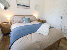 A bedroom with a bed and bedside table at 31 Bull Lane, Dorchester