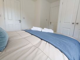A bedroom with a bed and towels at 31 Bull Lane in Dorchester