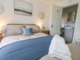 A bedroom with a bed and an attached bathroom at 31 Bull Lane Dorchester