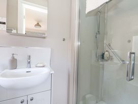 A bathroom with a shower and sink at 31 Bull Lane Dorchester