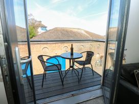 A balcony with table and chairs at Quayside Apartments in Whitehaven
