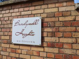 A sign on a brick wall at Bardywell Heights in Whitehaven