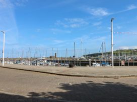 A marina with boats and masts at Quayside Apartments in Whitehaven