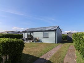 An outdoor view of a house with a garden at Stella Maris in Torpoint