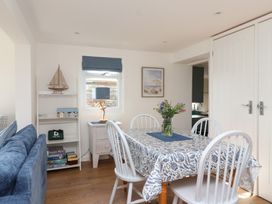 A dining room with a table and chairs at Stella Maris in Torpoint