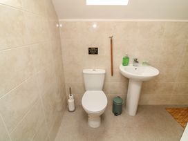 A bathroom with a toilet and sink at James Ville Marina Lodge 22 in Brigg