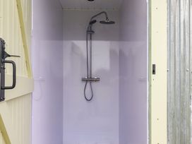 A shower area with a shower head at Robin in Monewden near Otley, Suffolk