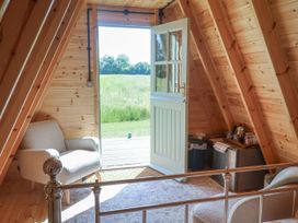 A room with a door opening to a field at 1 Bed Sleeps 2, Shared Bathroom in Monewden near Otley, Suffolk