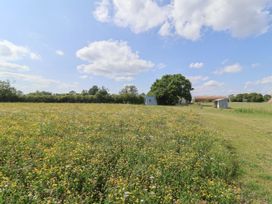 An outdoor area with wildflowers and buildings at 1 Bed Sleeps 2, Shared Bathroom in Monewden near Otley, Suffolk